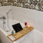 Convenient wooden bath bar - perfect for resting your book, e-reader, wine glass and scented candles. Comfort, convenience and luxury.. bliss. Contact Us / Contactez-nous