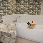 Bath, convenient bath bar and a comfortable armchair. What's not to love?